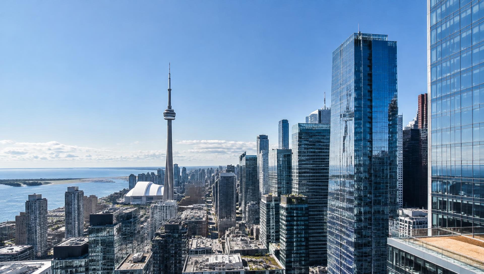 Toronto skyline with the CN Tower and glass office towers; illustrative architectural image